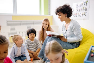 Teacher reading to children